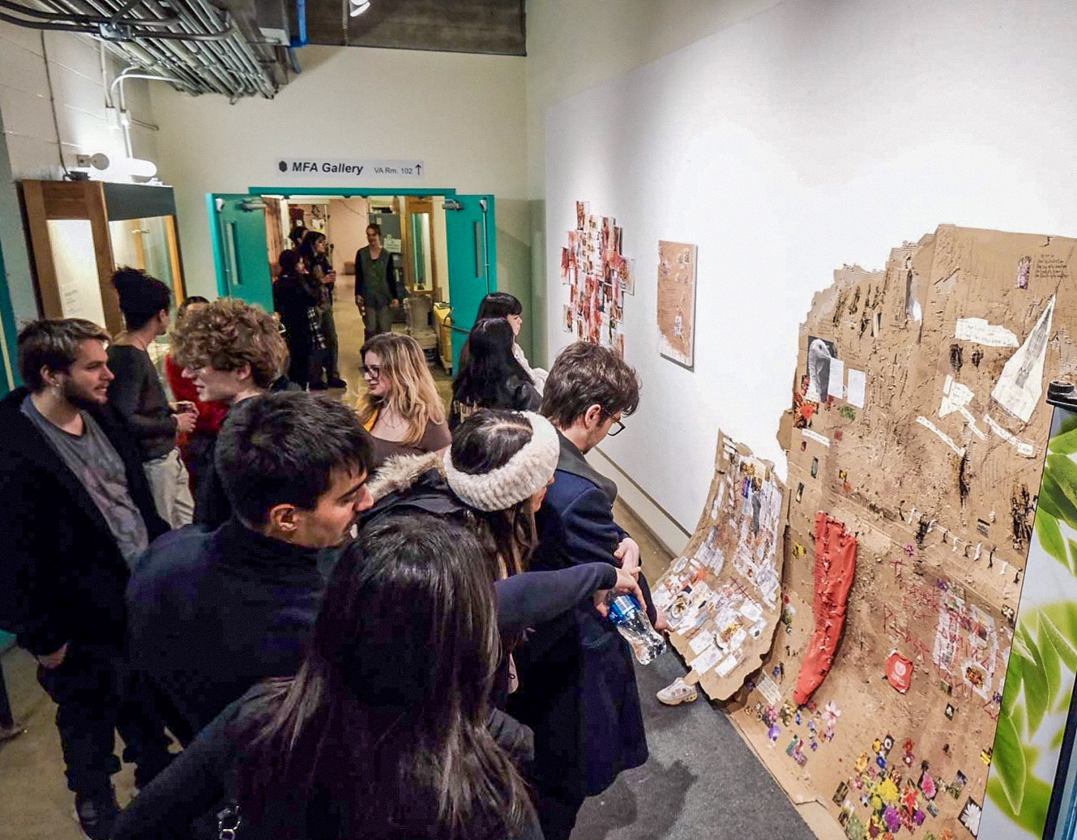 Visitors viewing cuts/stitches in its original gallery context
