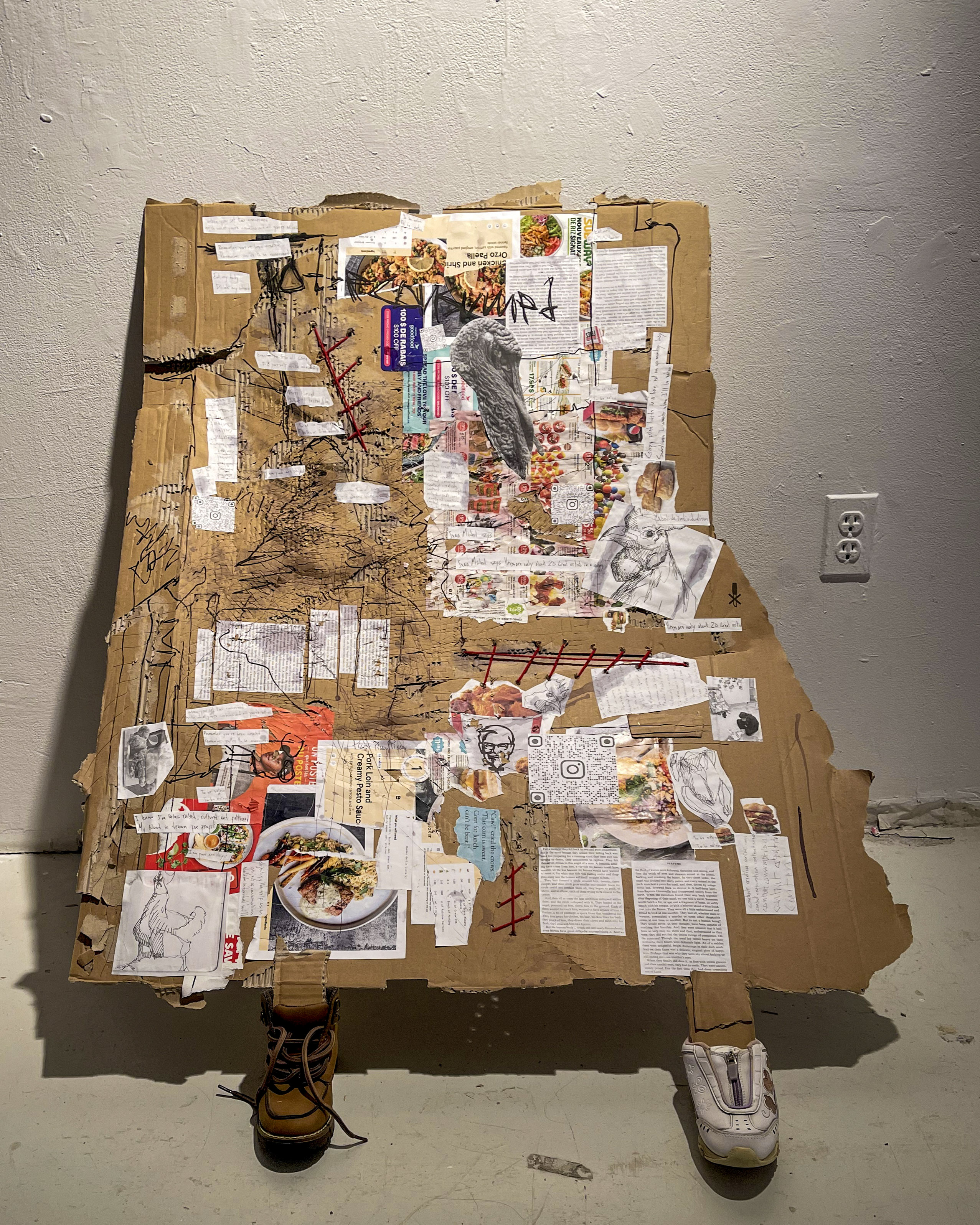 Full view of Thank You For Coming, Please Don’t Go with its cardboard body and attached shoes