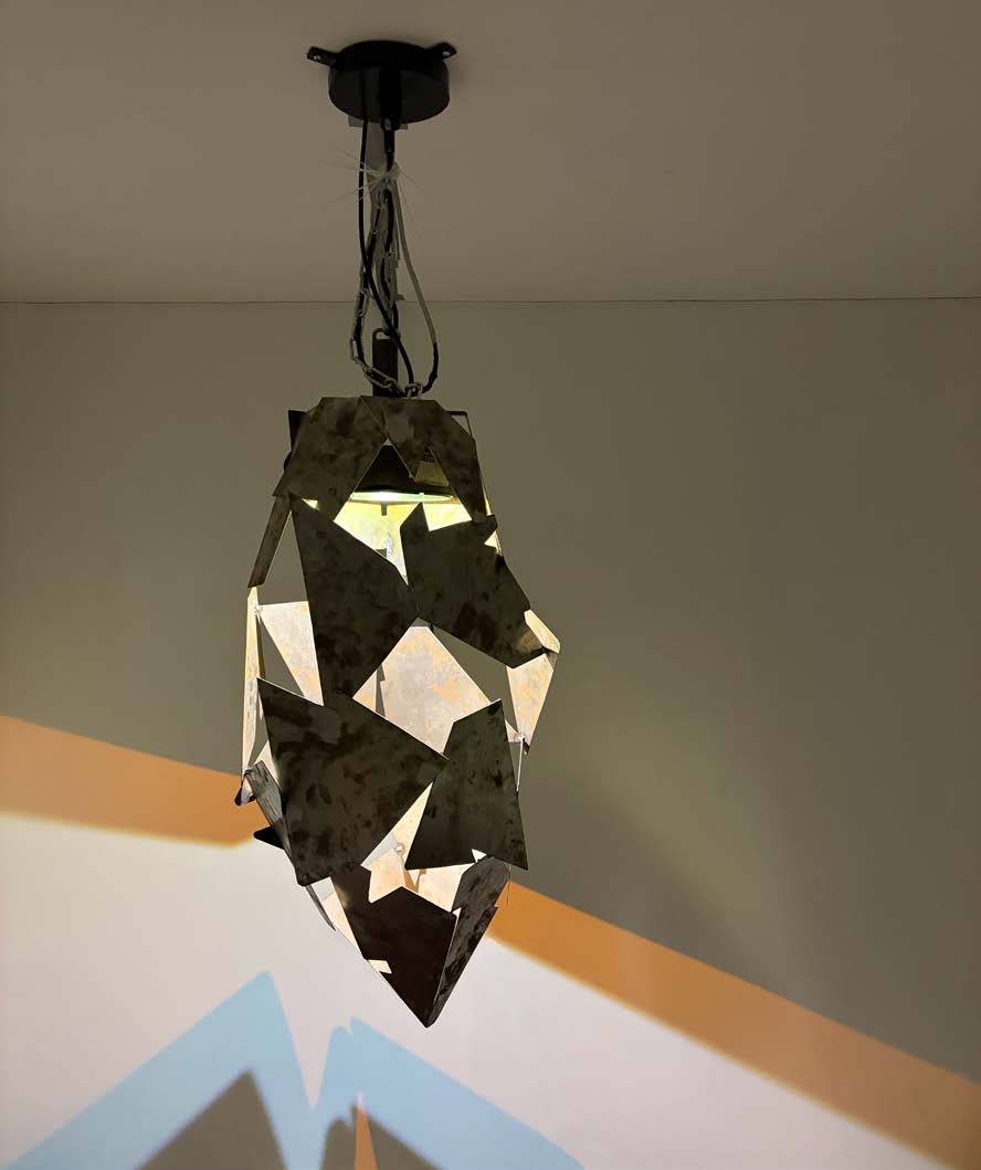 Suspended metal lamp sculpture from love_